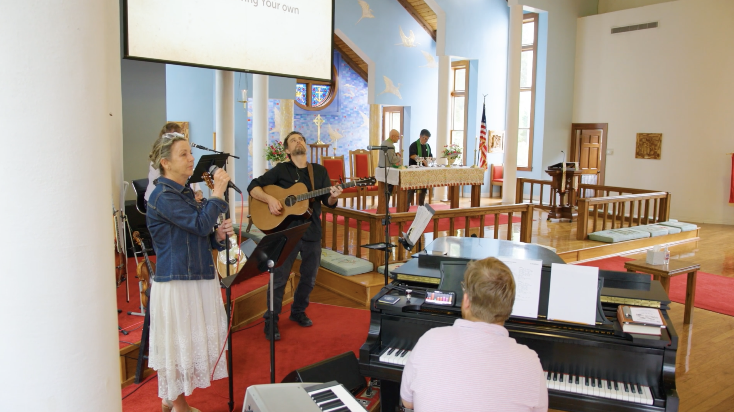 Worship musicians playing guitar during church service